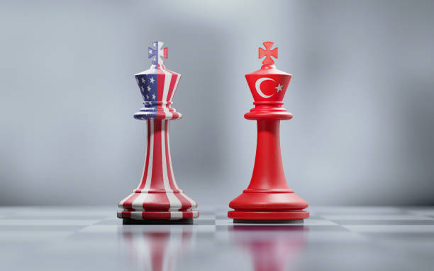 istock Two King Chess Pieces Textured With American And Turkish Flags On Black And White Chessboard 1035135912