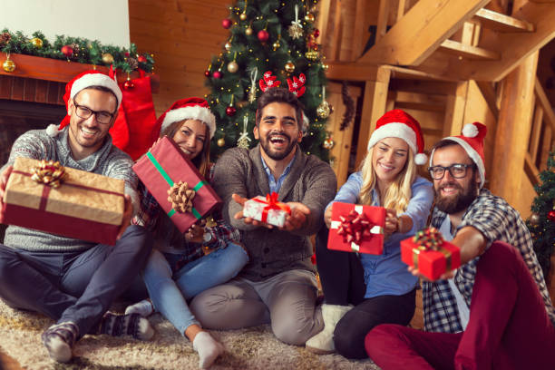 istock Friends exchanging presents on Christmas morning 1035136330