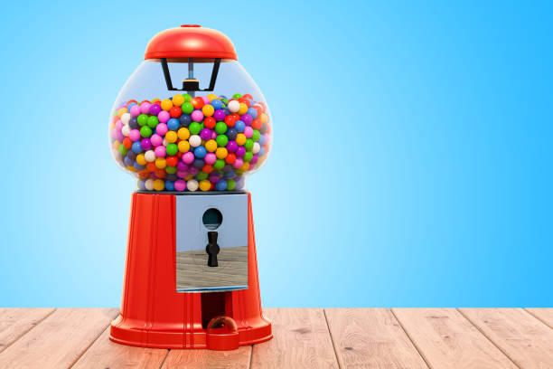 Gum dispenser on the wooden background. 3D rendering Gum dispenser on the wooden background. 3D rendering gumball machine stock pictures, royalty-free photos & images