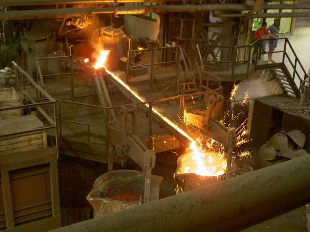 istock Metal molten flowing to conteiner in foundry 1035146118