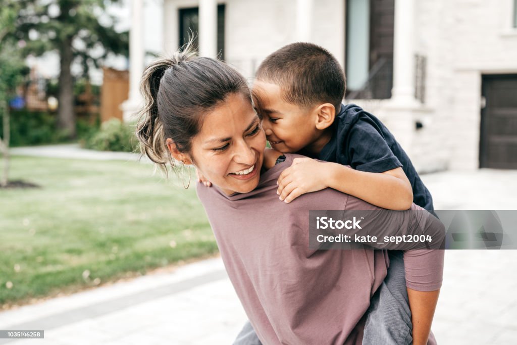 Mom and son having fun outdoor Happy parent and kid Child Stock Photo