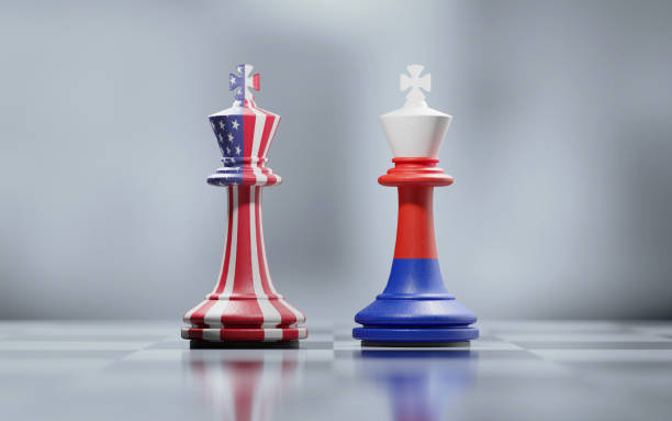 istock Two King Chess Pieces Textured With American And Russian Flags On Black And White Chessboard 1035146772