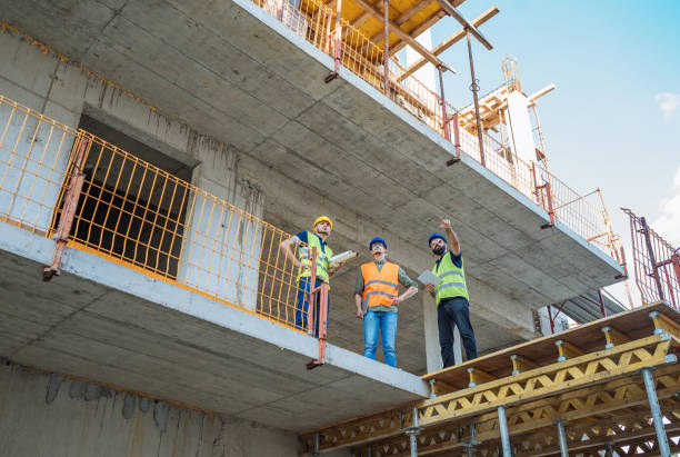 istock Engineers standing at the edge of construction platform 1035149276