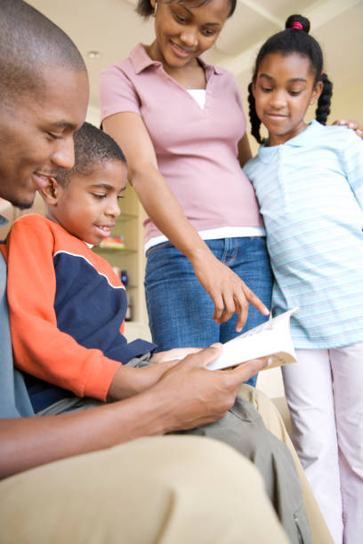 istock African family reading book together 1035150416