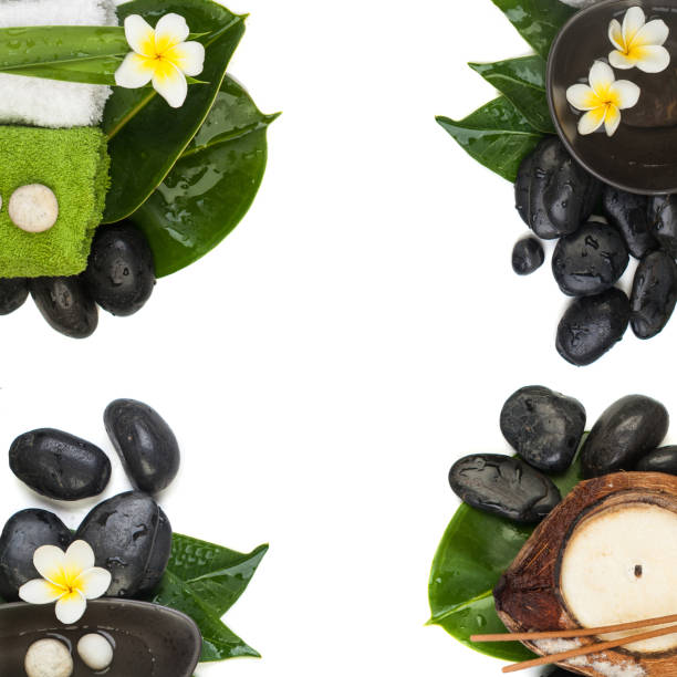 istock Top view of four spa tropical sets (stones, towels, leaves, flowers) for healthy therapy 1035153664