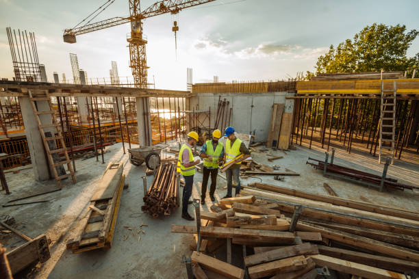 istock Construction site in the city with engineers and construction workers 1035156906