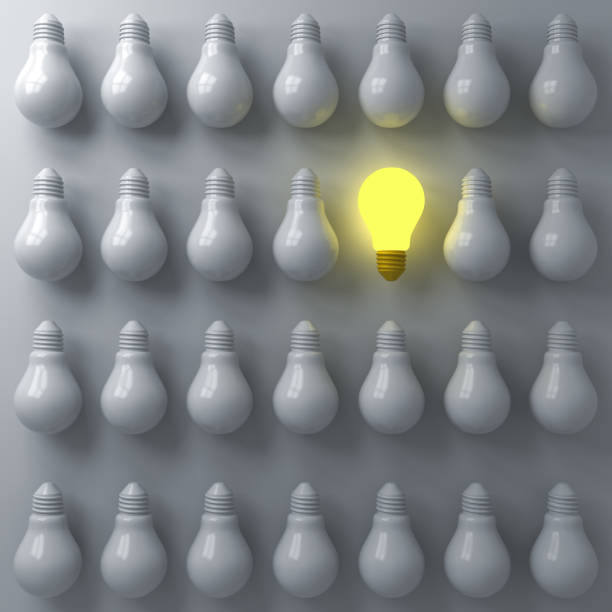 istock One glowing light bulb standing out from the unlit or dim bulbs on dark white background individuality and think different the business creative idea concepts 3D rendering 1035164728