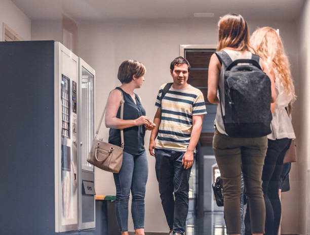 istock Adult Students Socialize In School's Corridor 1035165632