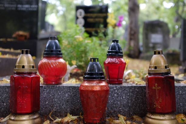 istock Commemorative candles in the cemetery 1035166636