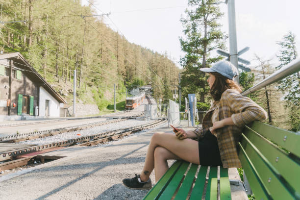 Woman waiting  for Gornergrat train on the train station