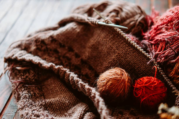 istock Favorite winter pass time. Knitting a warm stranded sweater. 1035169358