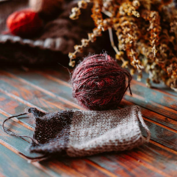 istock Favorite winter pass time. Knitting a sample of warm stranded sweater. 1035169380