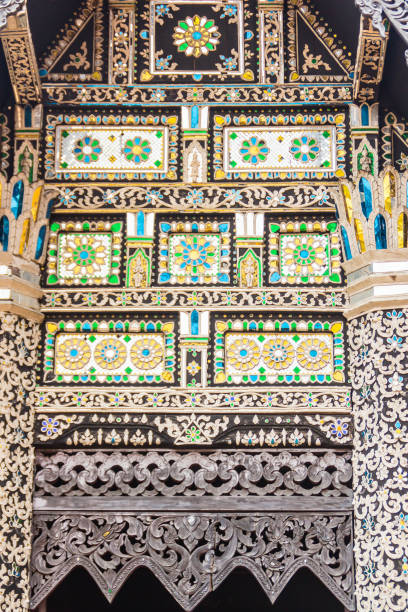 istock Beautiful Lanna's style pattern background on the Buddhist church gable end. Northern Thai golden pattern background crafts on the gable in the Buddhist temple with Lanna style at Chiang Mai, Thailand 1035174968