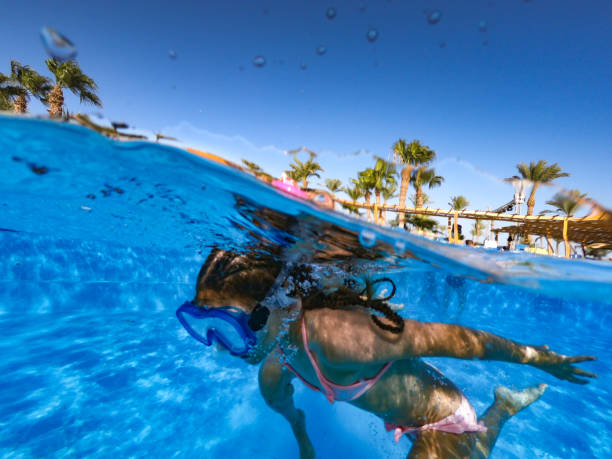 istock Joyful Mother And Daughter Having Fun In Pool During Vacations In Egypt 1035180996