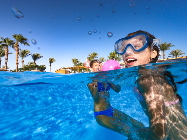 istock Joyful Mother And Daughter Having Fun In Pool During Vacations In Egypt 1035180998
