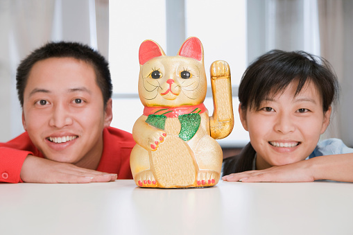 Chinese couple with fortune cat