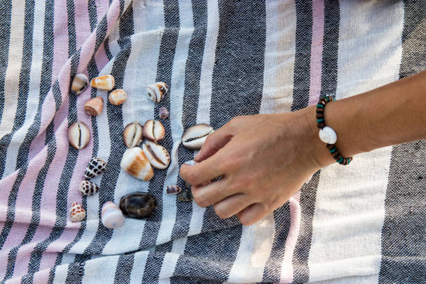 Beach Shell Sorting 140+ Young Woman Holding A Conch Shell Stock Photos, Pictures & Royalty ...