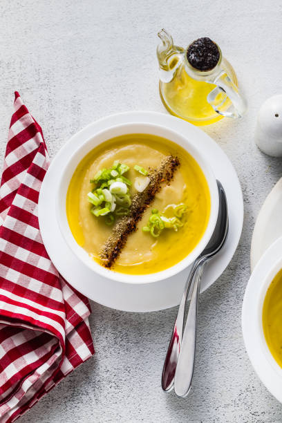 istock vegetable cream soup from vegetables, served on a table with olive oil. healthy kitchen 1035194892