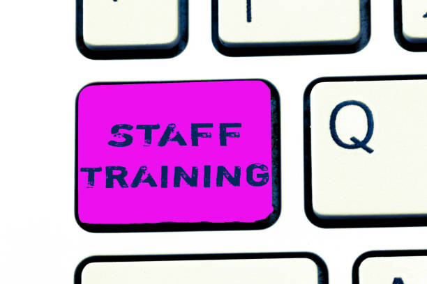 istock Text sign showing Staff Training. Conceptual photo A program that helps employees to learn specific knowledge 1035195080