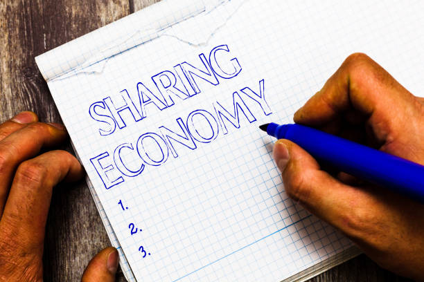 istock Handwriting text writing Sharing Economy. Concept meaning economic model based on providing access to goods 1035198432