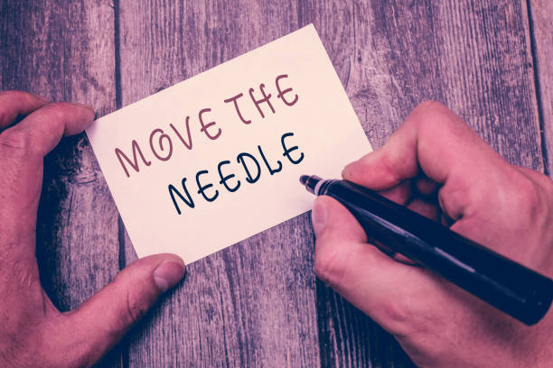 istock Writing note showing Move The Needle. Business photo showcasing Make a noticeable difference in something do better 1035198642