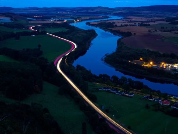 Traffic travels the A90 at Kinnoul Hill, Perth at dusk.