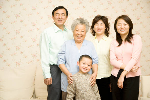 istock Chinese multi-generational family smiling at camera 1035204746