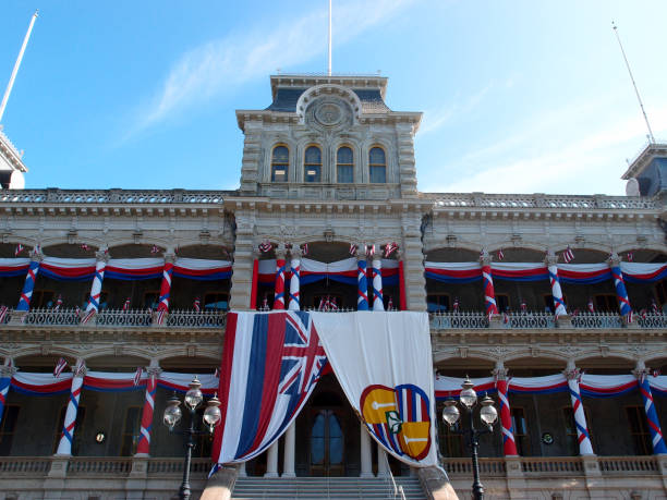 istock Iolani Palace covered in Hawaii State and Hawaiian Kingdom Flags 1035226196