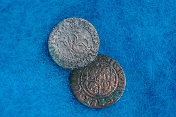 istock two old rare silver coins on blue woolen cloth 1035229636
