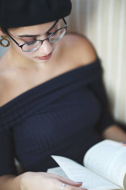 istock Young woman book reading 1035235210