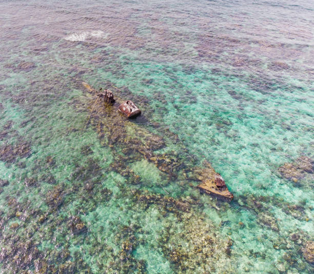 istock Half Submerged Shipwreck on Coral Reef 1035237414