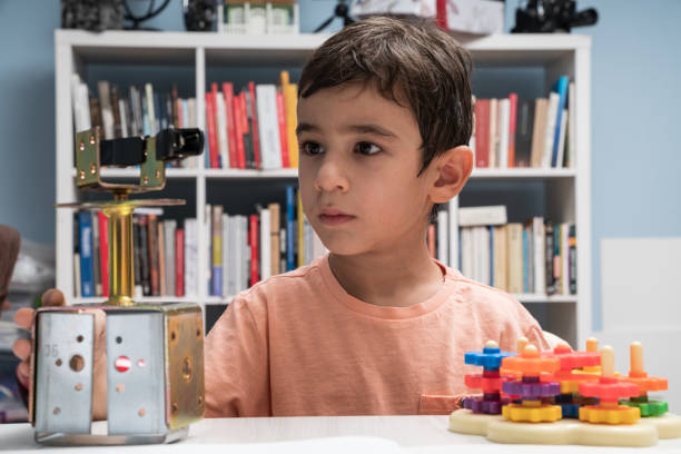 istock Portrait Of Schoolboy Learning How To Use Wheels For Robotics 1035237422