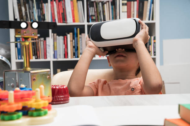 istock Portrait of Little Boy Using Virtual Reality Headset 1035237790