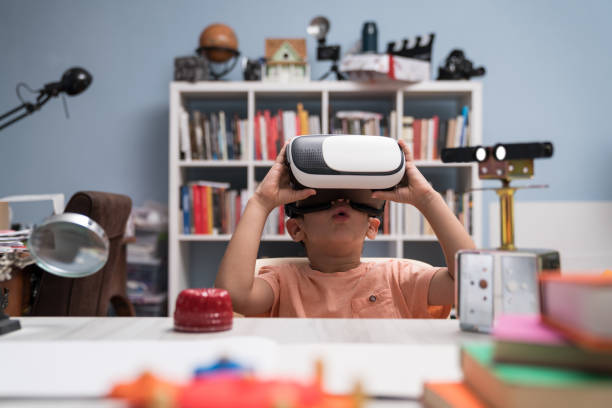 istock Portrait of Little Boy Using Virtual Reality Headset 1035238102