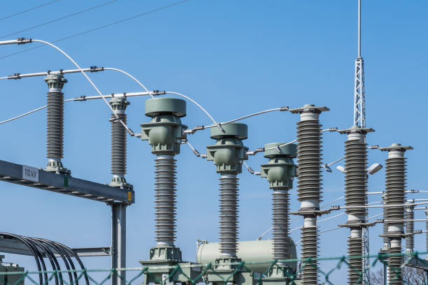 istock Low Angle View Of Power Lines Against Clear Blue Sky 1035245952