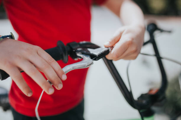 istock Midsection Of Boy Holding Bicycle Handlebar 1035249646