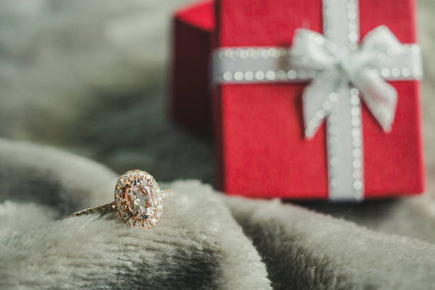 istock jewelry pink diamond ring with red gift box background 1035264748