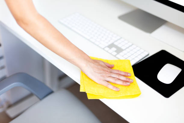 istock Woman is Cleaning an Office Table 1035265136