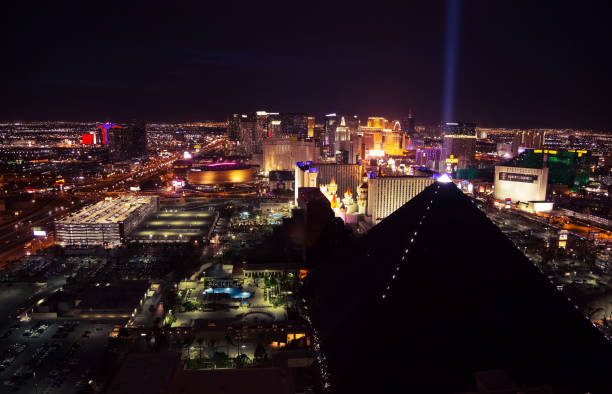 Panoramic aerial view of Las Vegas strip at night Las Vegas, USA - April 2018: Panoramic aerial view of the Las Vegas strip with casinos and hotels at night. Night view of Las Vegas from the hotel window. las vegas pyramid stock pictures, royalty-free photos & images