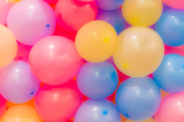 istock Many colorful balloons decorated wall as background 1035268496