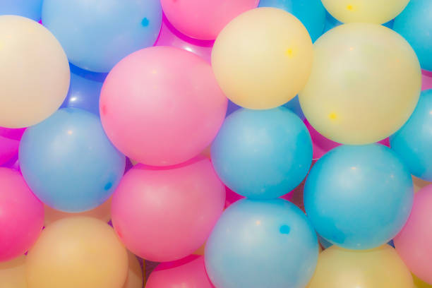 istock Many colorful balloons decorated wall as background 1035269514