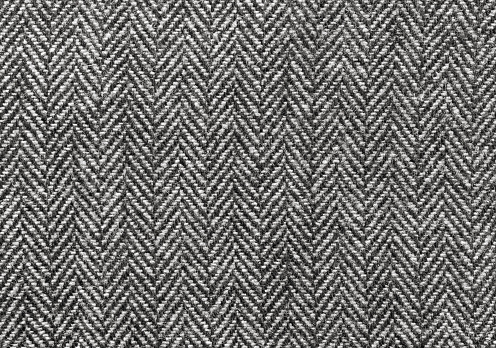 Black and white herringbone wool fabric background