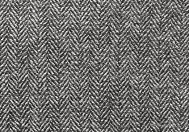 Herringbone Wool Fabric Background Black and white herringbone wool fabric background tweed stock pictures, royalty-free photos & images