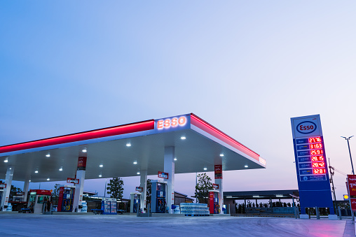 Si Racha, Chonburi /Thailand - April 18, 2018: ESSO gas station with blue sky background during. Esso gas stations and products including gasoline, diesel, motor oil, gift cards, credit cards and more