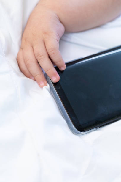 istock Conceptual image of a newborn baby and mobile 1035283696