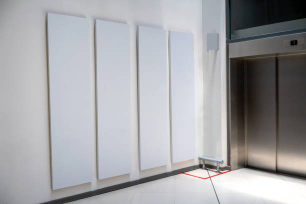 istock Four big vertical poster on white background in front of elevator 1035288408