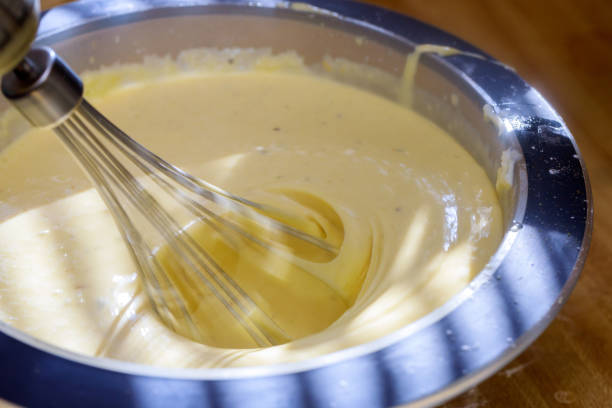 istock Mixing chocolate and cream. Cream Cake 1035290798