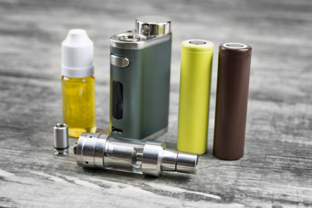 istock E - cigarette for vaping , technical devices.The liquid in the bottle 1035305678