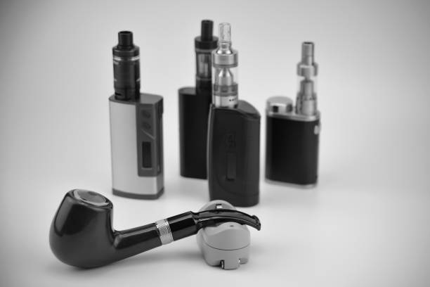 istock E - cigarette for vaping , technical devices.The liquid in the bottle 1035305738