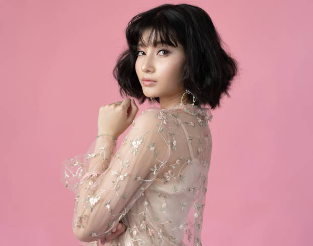 Portrait beautiful woman asian with clean skin, natural make-up,pink background Portrait beautiful woman asian with clean skin, natural make-up,on pink background asian american model stock pictures, royalty-free photos & images